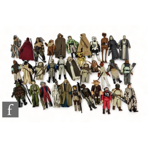 A collection of Kenner Star Wars action figures, mostly complete with accessories. (33)