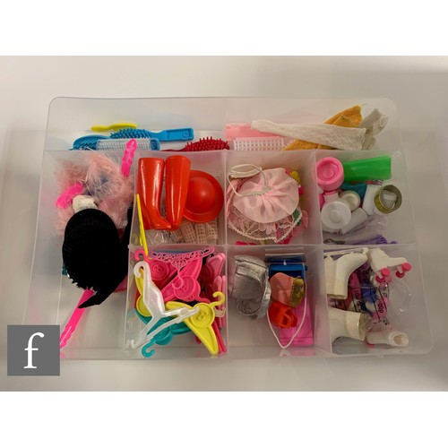 96 - A collection of Barbie clothes and accessories, 1960s-1990s, to include clothes, including 1964 Guin... 