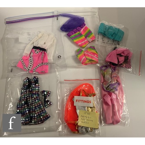 96 - A collection of Barbie clothes and accessories, 1960s-1990s, to include clothes, including 1964 Guin... 