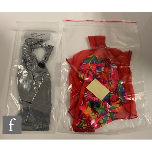 96 - A collection of Barbie clothes and accessories, 1960s-1990s, to include clothes, including 1964 Guin... 