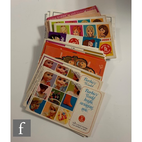 96 - A collection of Barbie clothes and accessories, 1960s-1990s, to include clothes, including 1964 Guin... 