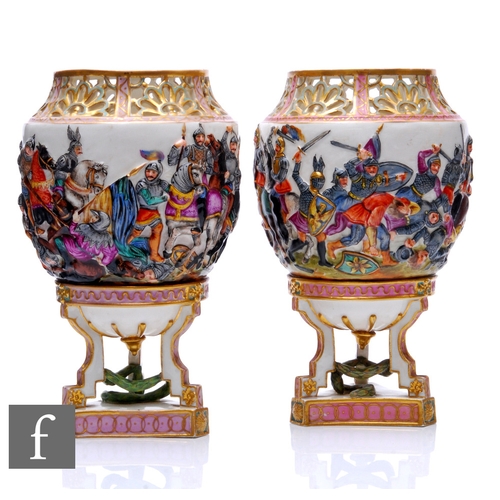 830 - A pair of large late 19th Century Capodimonte porcelain potpourri urns, of footed shouldered ovoid f... 