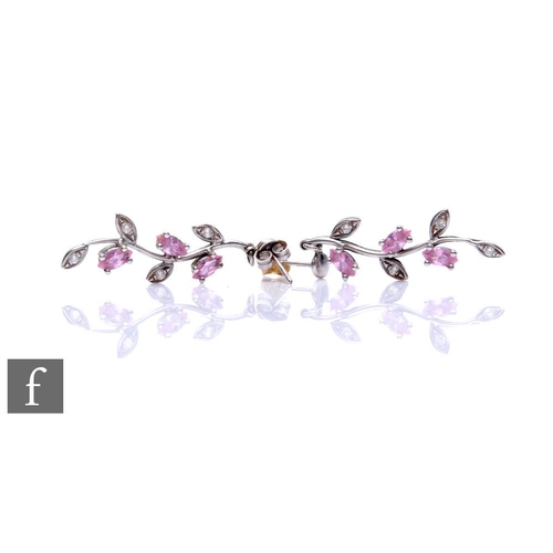 147 - A 9ct white gold pink sapphire and diamond necklet, claw set stones to a leaf design, with a matchin... 