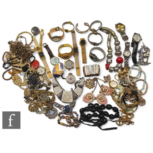 148 - A parcel lot of assorted costume jewellery and other items to include beads, brooches, watches, chai... 