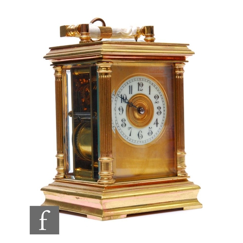 275 - An early 20th Century brass carriage clock, circular Arabic dial in Corinthian column stepped case w... 