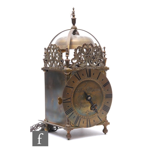 283 - A 17th Century style brass lantern clock, the circular dial inscribed Thomas Moore Ipswich, the move... 