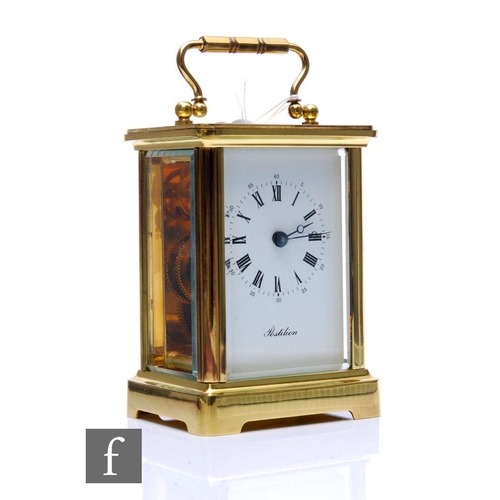 289 - A 20th Century French brass carriage clock, named 'Postilion', with key, height 12cm.