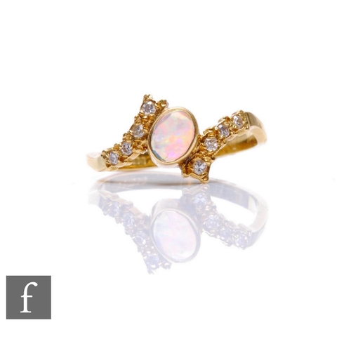 67 - An 18ct opal and diamond cluster ring, central oval opal flanked by four diamonds to each side, weig... 