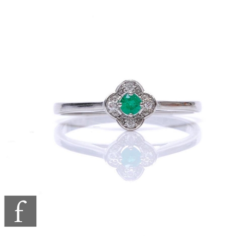 70 - A 10ct white gold emerald and diamond cluster ring, central claw set emerald to a four stone shaped ... 