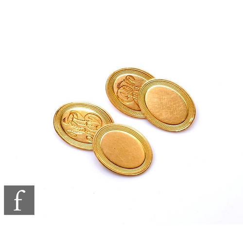 78 - A pair of 18ct oval chain linked cufflinks with engraved initials and engine turned decoration, weig... 