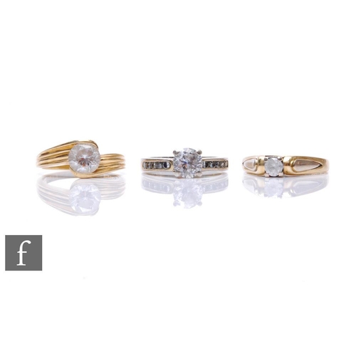 82 - Two 14ct rings each set with a single paste stone, total weight 7g, with a similar white metal examp... 