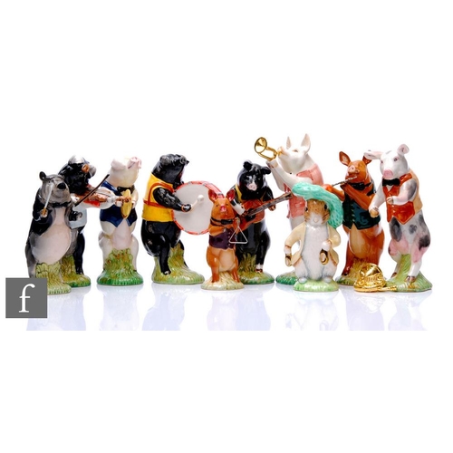 842 - A Beswick Pig Promenade Band, comprising PP1 John the Conductor, PP9 Chris the Guitarist, PP8 Richar... 