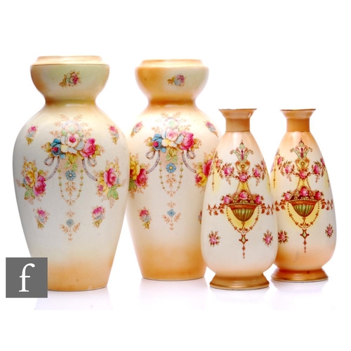 846 - A pair of Crown Devon blush vases in the Wye pattern, ovoid form, decorated with a garland of flower... 