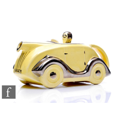 851 - A 1930s Sadler 'Racing Car' teapot, in yellow colourway, with silvered highlights, OKT42 number plat... 