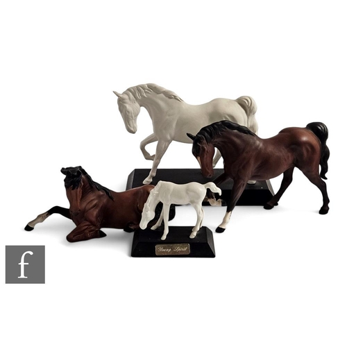 863 - A collection of Beswick horse figures, to include Spirit of Freedom, Young Spirit, and two bay horse... 