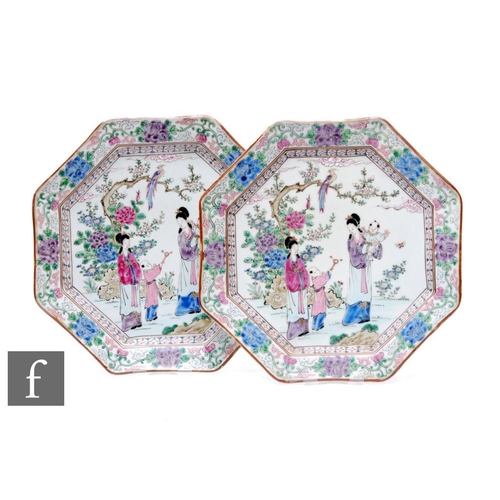 887 - A pair of Chinese late Qing Dynasty famille rose octagonal dishes, decorated with figures and childr... 