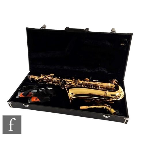 302 - A brass saxophone by Signature series, cased.