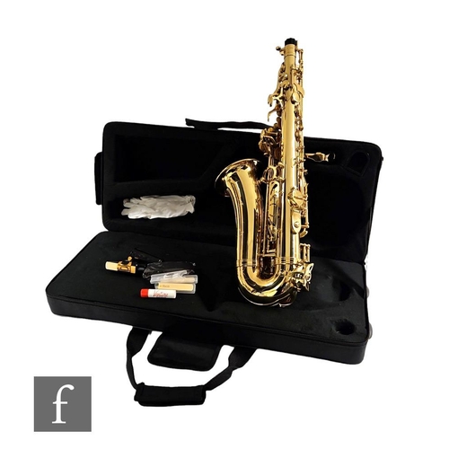 303 - A brass Saxophone by Gear4music, in plush lined zip case.