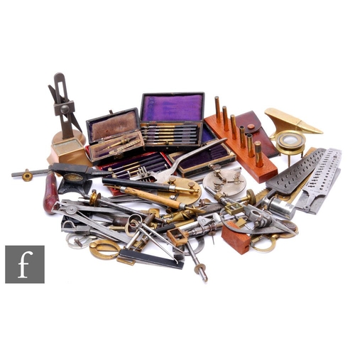 314 - A large assortment of 19th and early 20th Century watch maker's tools, to include callipers, measuri... 