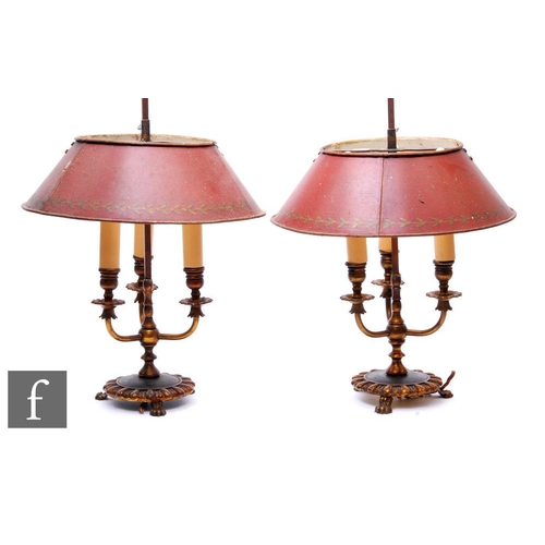 318 - A pair of 1950s or later triple gilt sconce table lamps, each with fixed handle above toleware type ... 