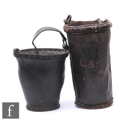 328 - An early 19th Century studded leather fire bucket and a similar example later monogramed LB. (2)