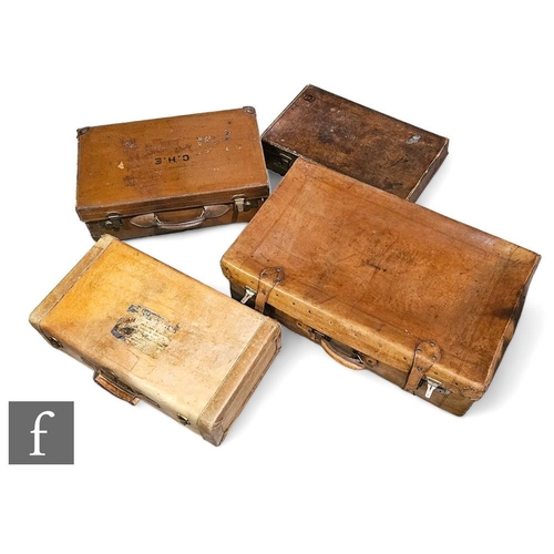 330 - Three vintage brown stitched leather suitcases and a hide example. (4)