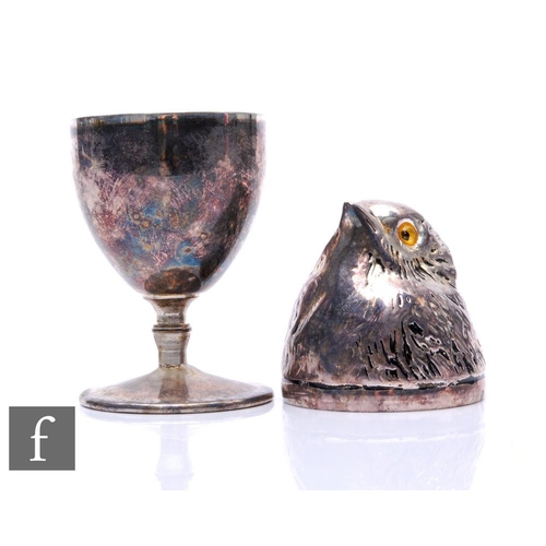 333 - An early 20th Century novelty plated egg cup holder modelled as a chick with feather detail and two ... 