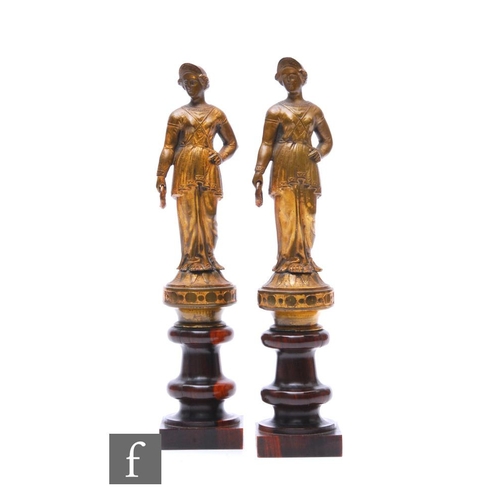 344 - A pair of late 19th Century gilt metal Romanesque figures, each on a turned hardwood base, height 24... 