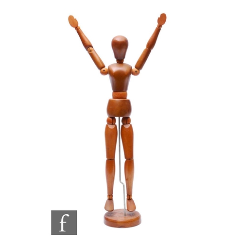 355 - A 20th Century wooden articulated artist's mannequin, height 44cm.