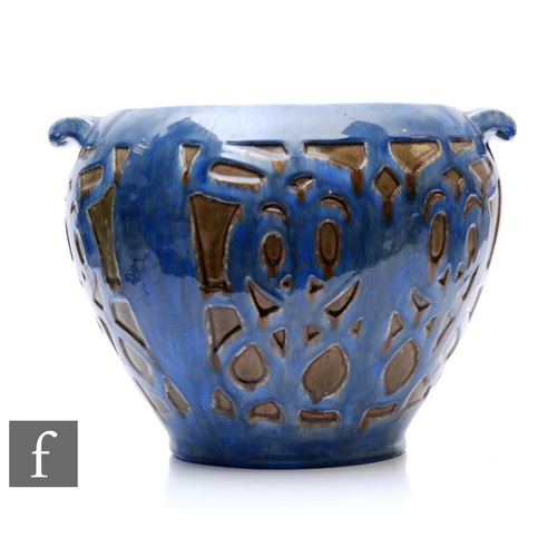 746 - An early 20th Century Arts and Crafts twin handled jardiniere, of shouldered tapering form, decorate... 