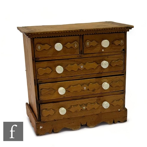 473 - A 19th Century Irish pine apprentice straight front chest of two short and three long drawers, carve... 