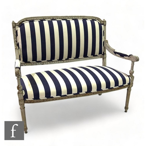 488 - An early 20th Century French white painted carved walnut three seater settee, upholstered back and s... 