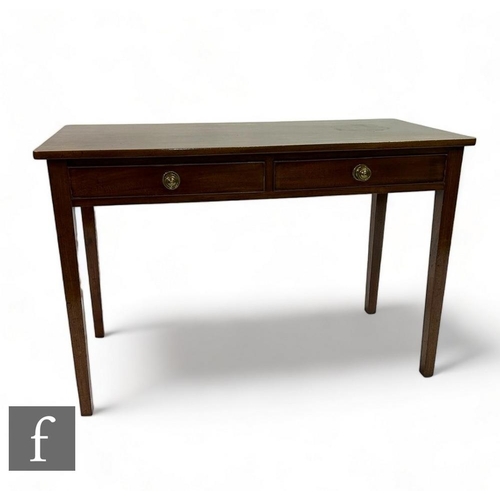 506 - A 19th Century mahogany two drawer side table fitted with brass handles, on square tapering legs, he... 