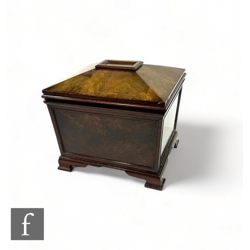 530 - A 19th Century mahogany wine cooler of sargcophagal form, with zinc liner, enclosed by a sloping lid... 