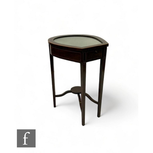 531 - An Edwardian line inlaid mahogany horseshoe shaped bijouterie cabinet, the glazed lid over slender s... 