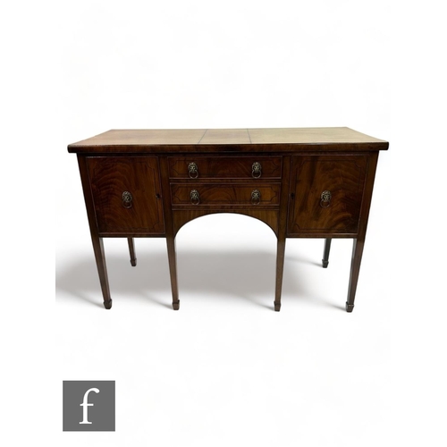 500 - An early 20th Century Regency style mahogany sideboard, fitted with two short drawers and flanked by... 