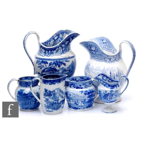 876 - A collection of 19th Century transfer and pearlware blue and white jugs, to include helmet, ovoid an... 