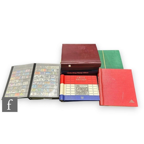 386 - A British stamp collection in nine albums, definitive and commemorative issues, franked and mint. (9... 