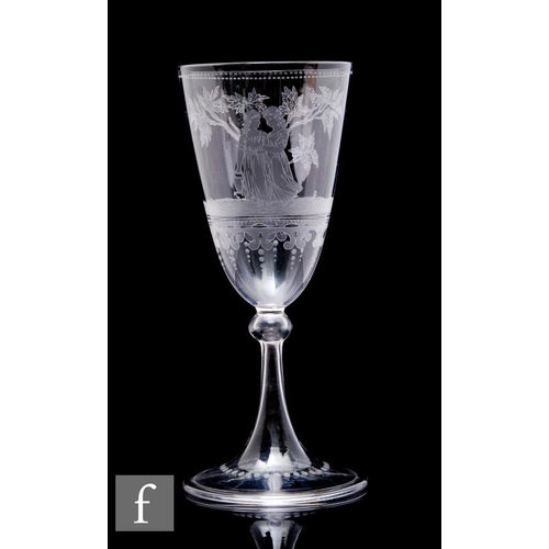 1127 - A 19th Century clear crystal drinking glass by John Northwood, the slender round funnel bowl acid et... 