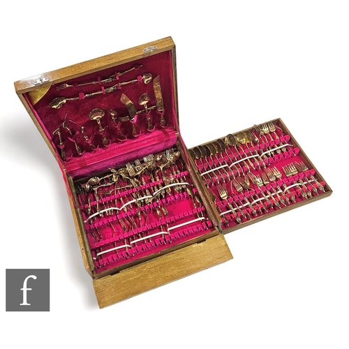 352 - A mid 20th Century Thai full canteen of gilt plated cutlery for twelve settings, contained in a fitt... 