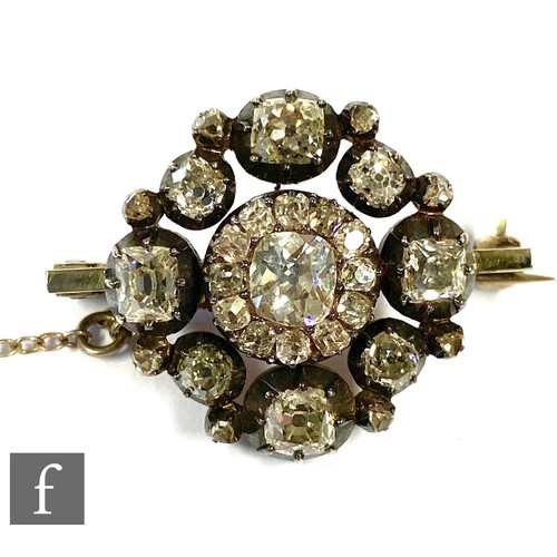 11 - A 19th Century old cut diamond set brooch, central diamond 5.4mm x 5mm, within a diamond set border ... 