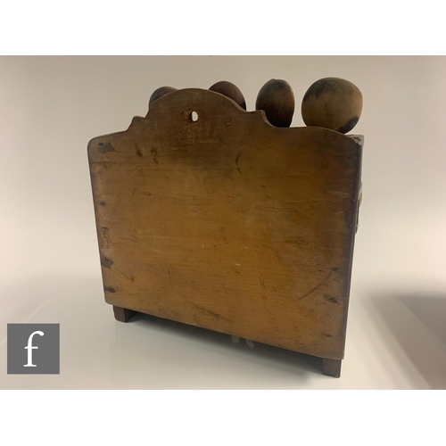 329 - A 19th Century oak Welsh three tier stepped spoon rack with later associated spoons, width 33cm.