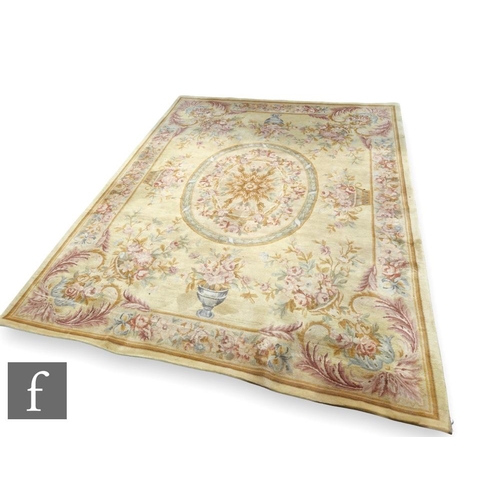 463 - A 20th Century Aubusson style carpet, centred with a medallion of flowers surrounded by baskets of f... 