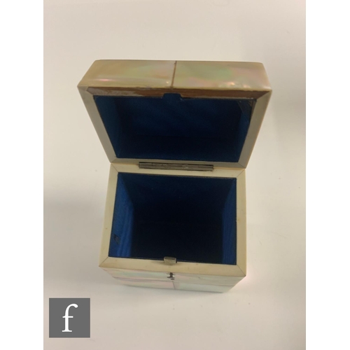 339 - A 19th Century mother of pearl card case, the hinged top concealing a blue liner, a papier mache snu... 