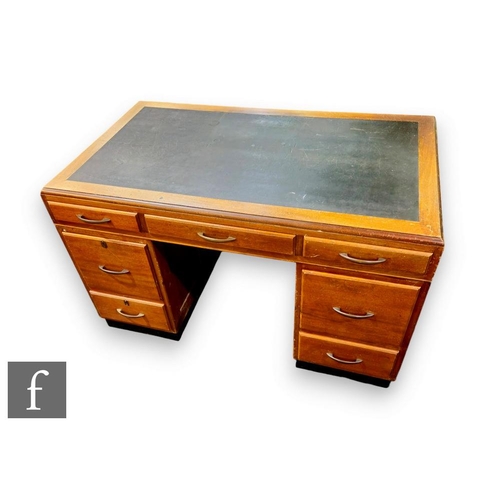 450 - A 1950s or later mahogany kneehole pedestal desk, fitted with three frieze drawers and two drawers t... 