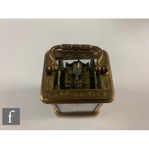 290 - A 19th Century French miniature brass carriage clock with sevres style porcelain panels to the face ... 