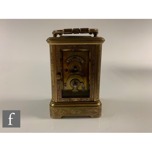 290 - A 19th Century French miniature brass carriage clock with sevres style porcelain panels to the face ... 