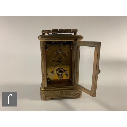 290 - A 19th Century French miniature brass carriage clock with sevres style porcelain panels to the face ... 