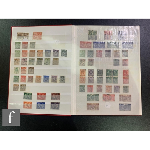 385 - Four British stock books of early mint and used stamps with later first class commemorative issues, ... 