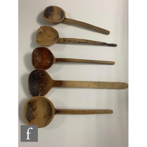 329 - A 19th Century oak Welsh three tier stepped spoon rack with later associated spoons, width 33cm.